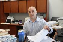 In this May 11, 2022 photo, Clark County Public Administrator Robert Telles, right, talked to L ...