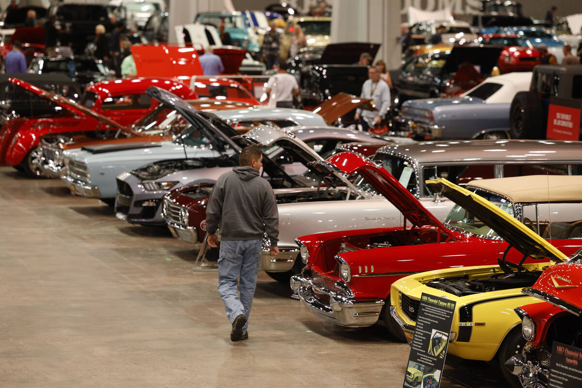 People check out cars during Mecum Las Vegas auction at the Las Vegas Convention Center, Thursd ...