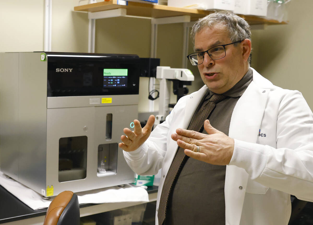 Dr. Martin Schiller, the founder of Heligenics, speaks as he leads a tour of the Heligenics' la ...