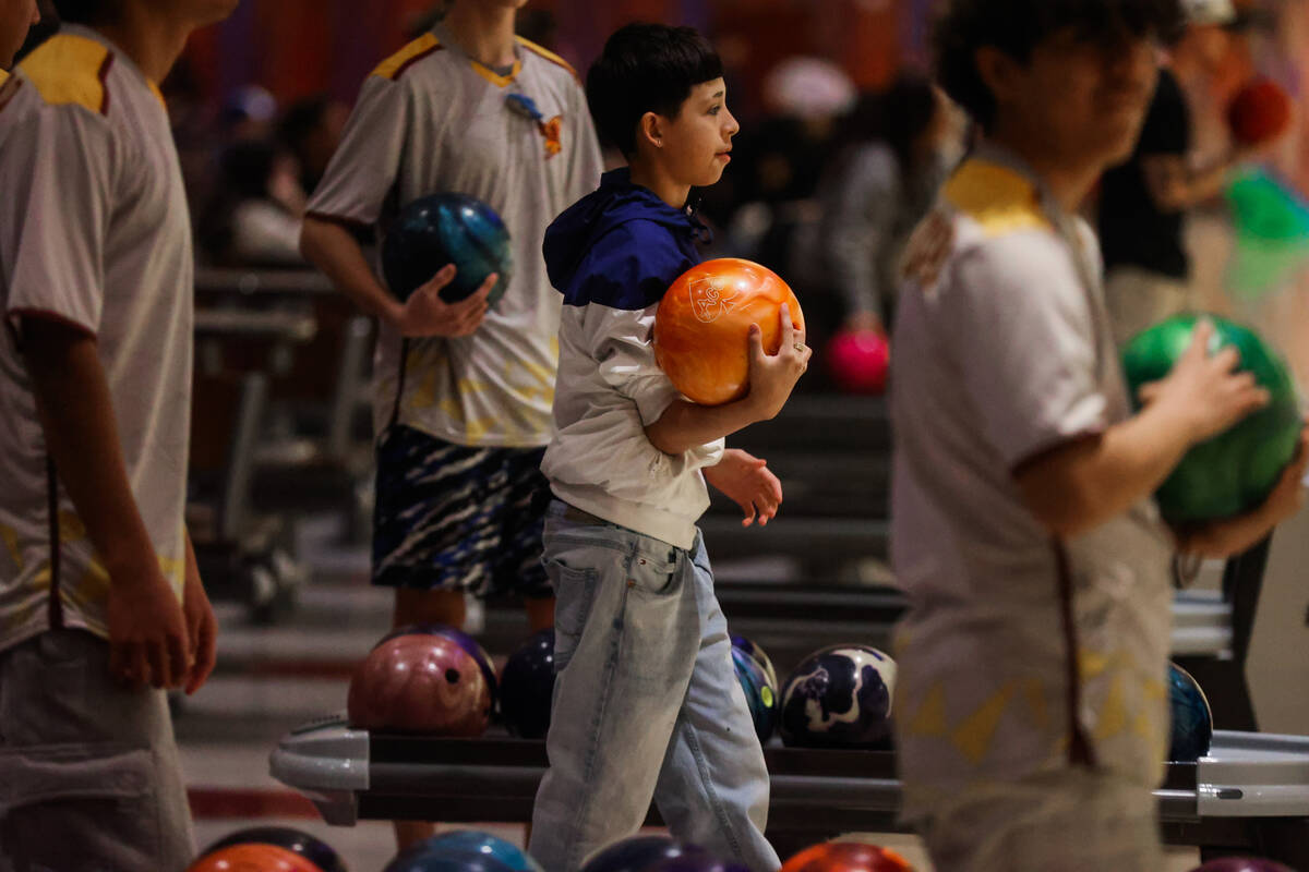 Students bowl during a high school bowling match between Coral Academy and Eldorado at The Orle ...