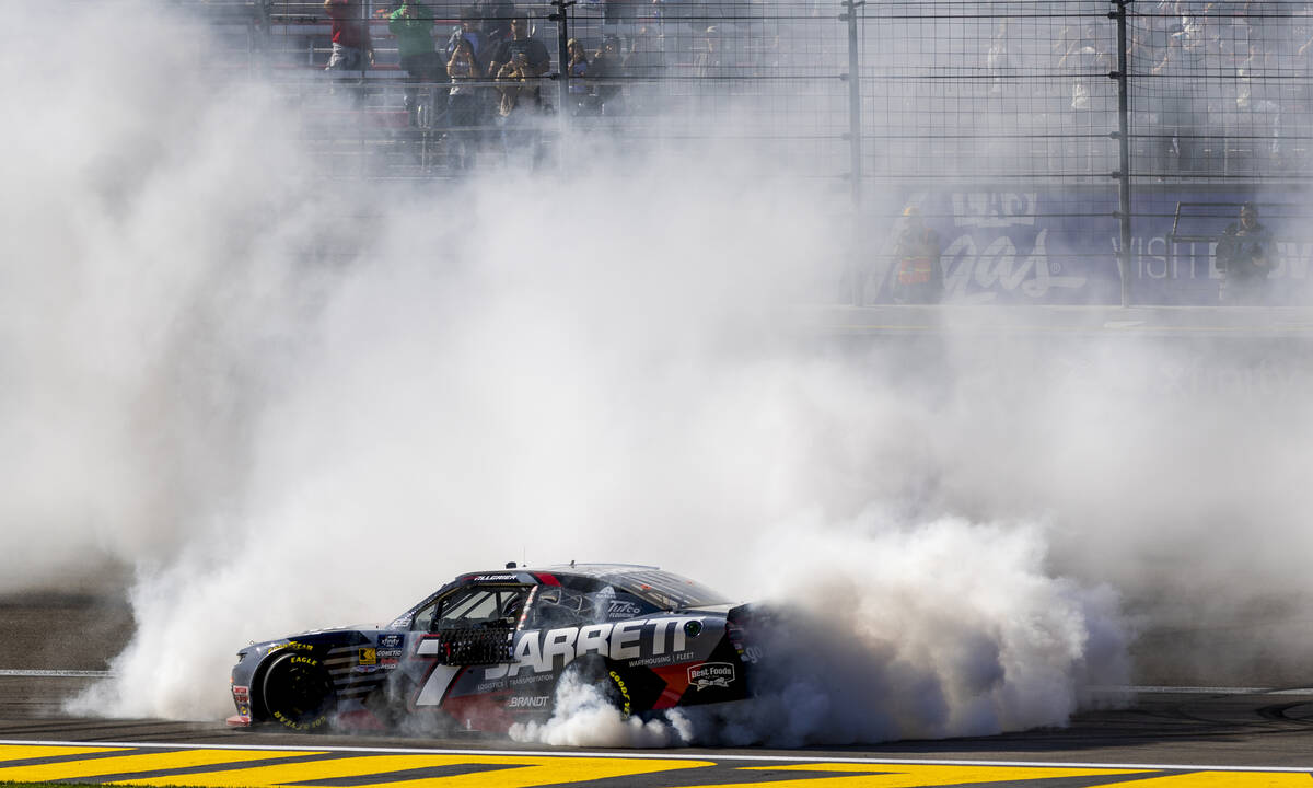 Justin Allgaier (7) burns his tires after crossing the finish line under a checkered flag winni ...