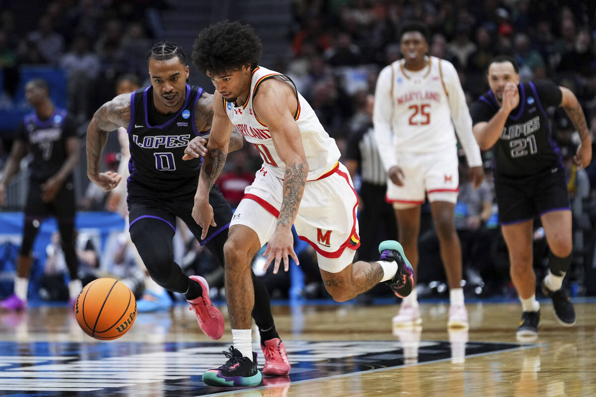 Maryland guard Ja'Kobi Gillespie runs for the ball against Grand Canyon guard Ray Harrison, lef ...
