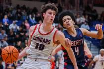 Coronado’s Mason Abittan (10) passes the ball to a teammate as Liberty shooting guard Ta ...