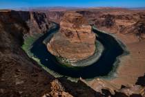 A boat cruises along the Colorado River near Horseshoe Bend on April 18, 2023, in Page, Ariz. ( ...