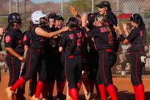 Doral Academy players celebrate during a softball game between Basic and Doral Academy at Basic ...