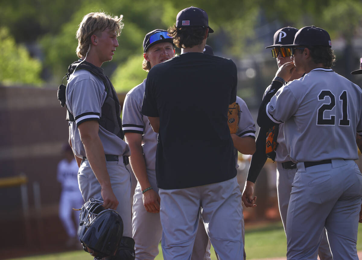 Palo Verde catcher Brady Dallimore, left, joins his teammates and a coach at the pitcher&#x2019 ...