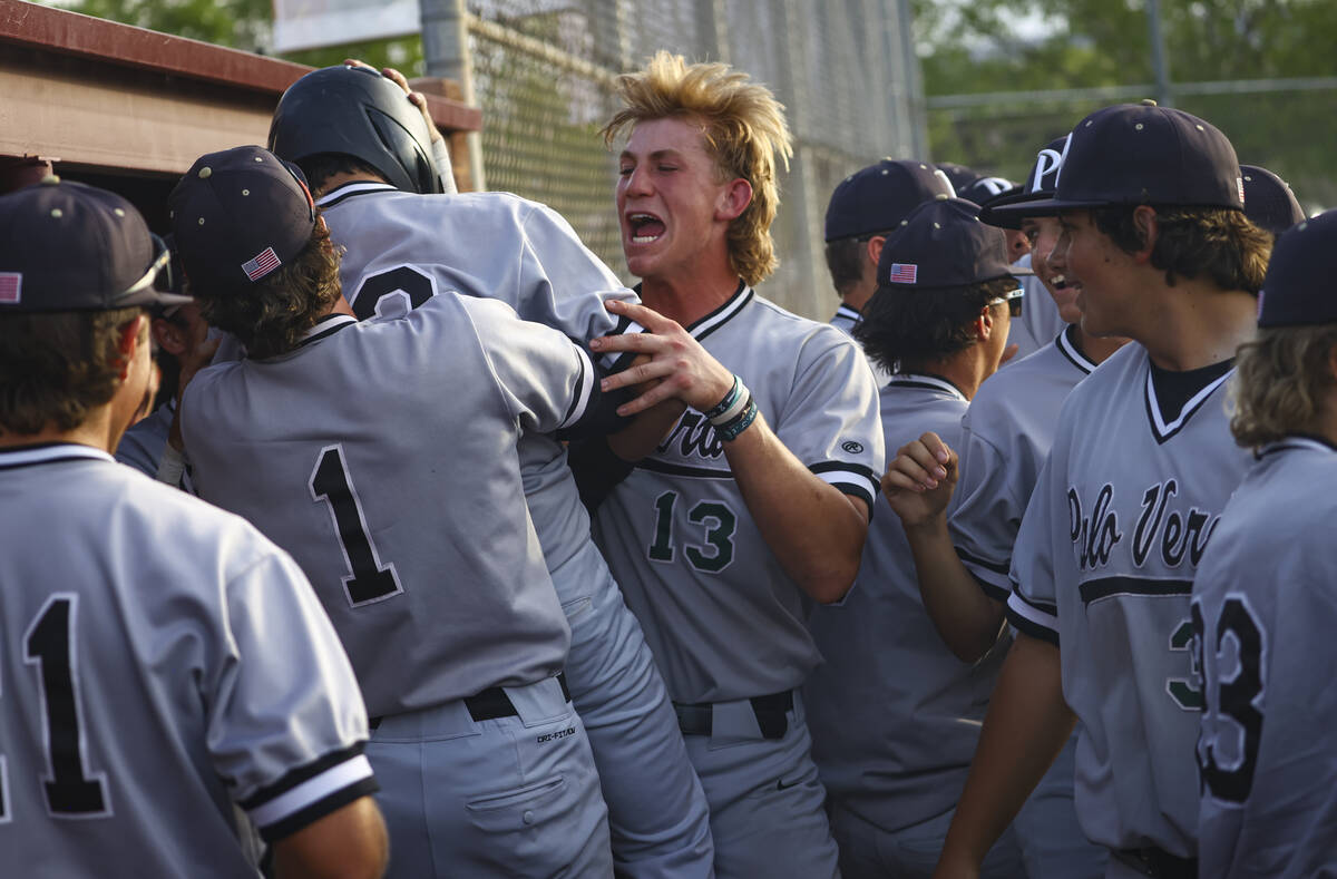 Palo Verde catcher Brady Dallimore (13) celebrates a teammate's run during a baseball game at F ...
