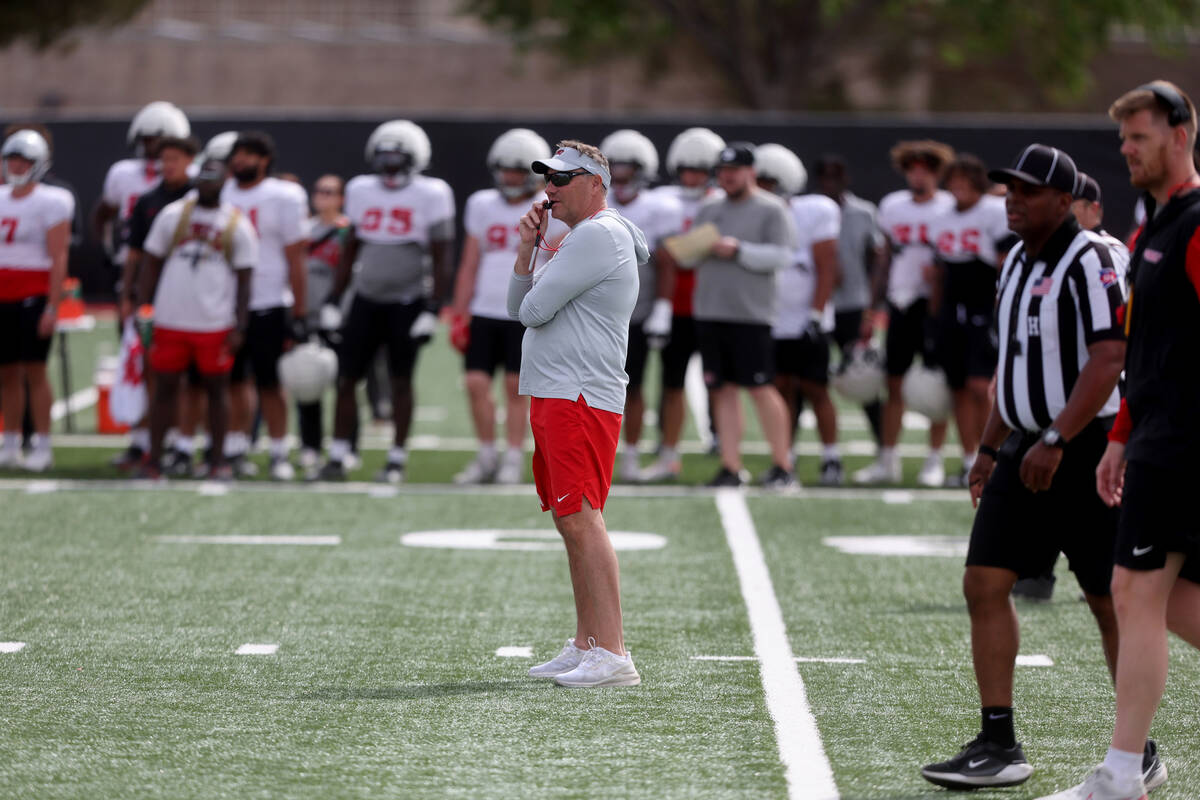 UNLV coach Dan Mullen watches his team scrimmage at Bill 'Wildcat' Morris Rebel Park in Las Veg ...