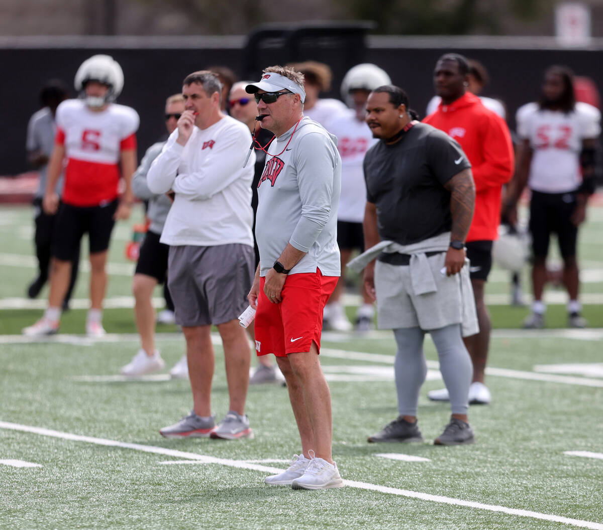 UNLV coach Dan Mullen. center, watches his team scrimmage at Bill 'Wildcat' Morris Rebel Park i ...