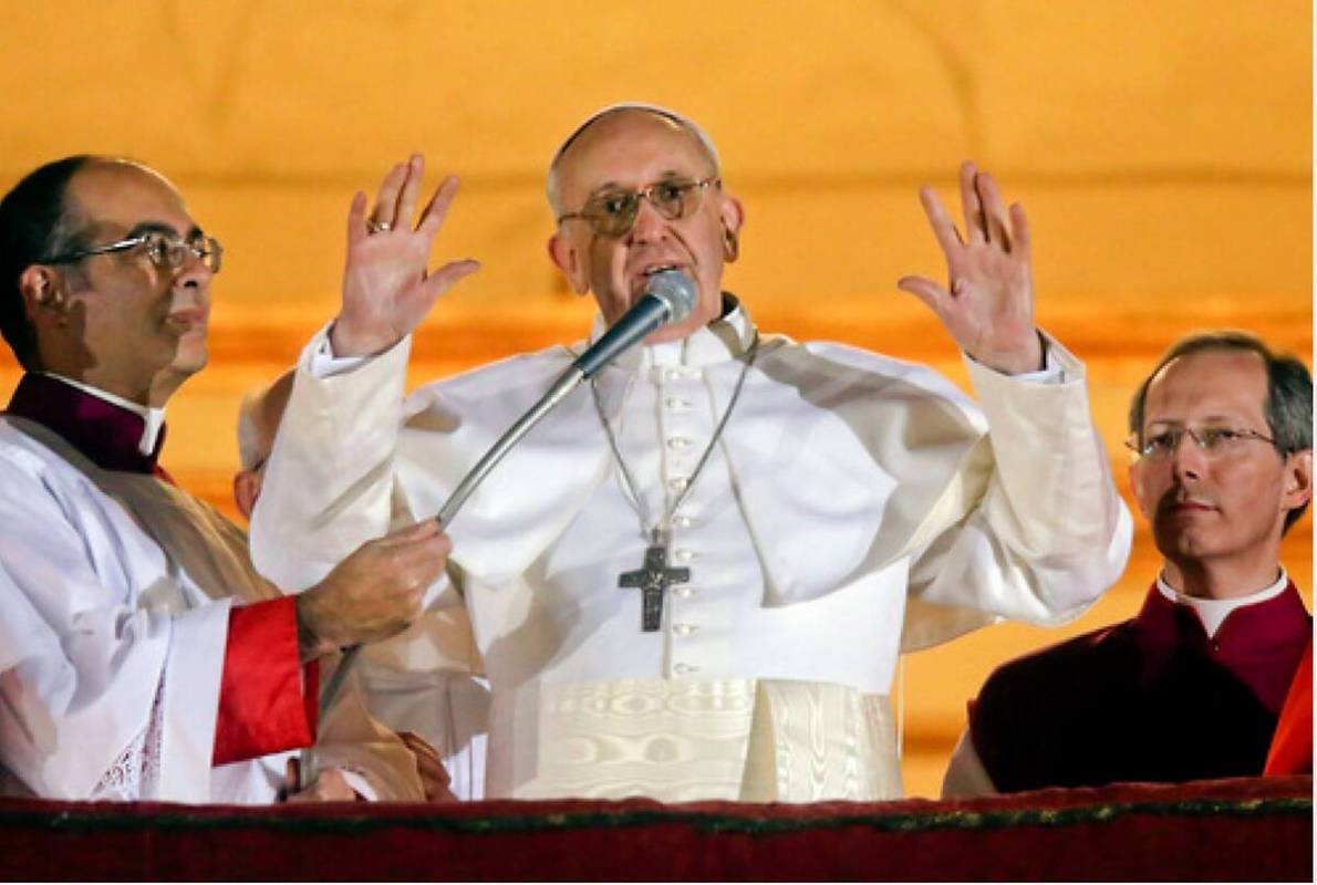 Argentine Cardinal Jorge Bergoglio, who chose the name of Pope Francis, waves to the crowd from ...