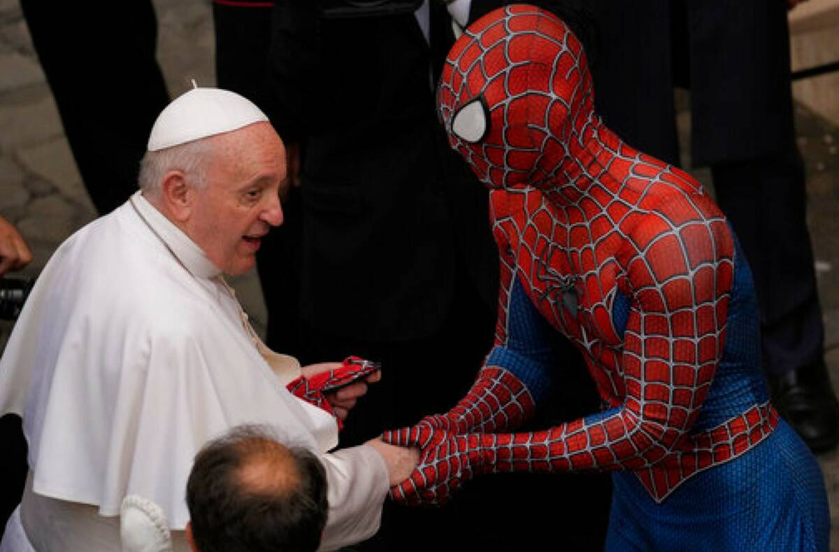 Pope Francis meets a man wearing a Spider-Man costume, who presented him with his mask, at the ...