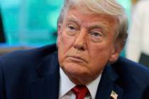 President Donald Trump speaks with reporters after signing executive orders in the Oval Office ...
