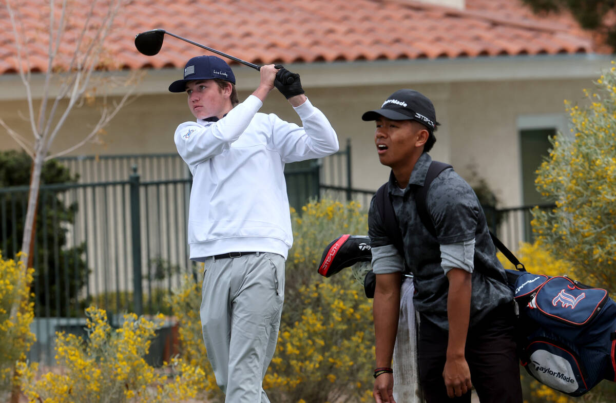 Scott Boschee of Bishop Gorman watches his tee shot on the third hole during the NIAA 5A Mounta ...