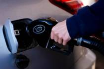 A driver fills up at a gasoline pump at a Shell gas station, Oct. 9, 2024, in Seattle. (AP Phot ...