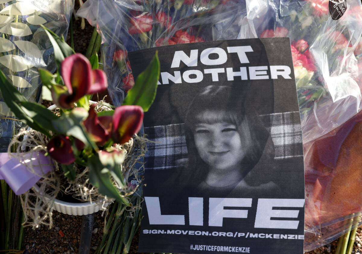 A flyer with a photograph of McKenzie Scott, a senior at Arbor View High School, who was killed ...
