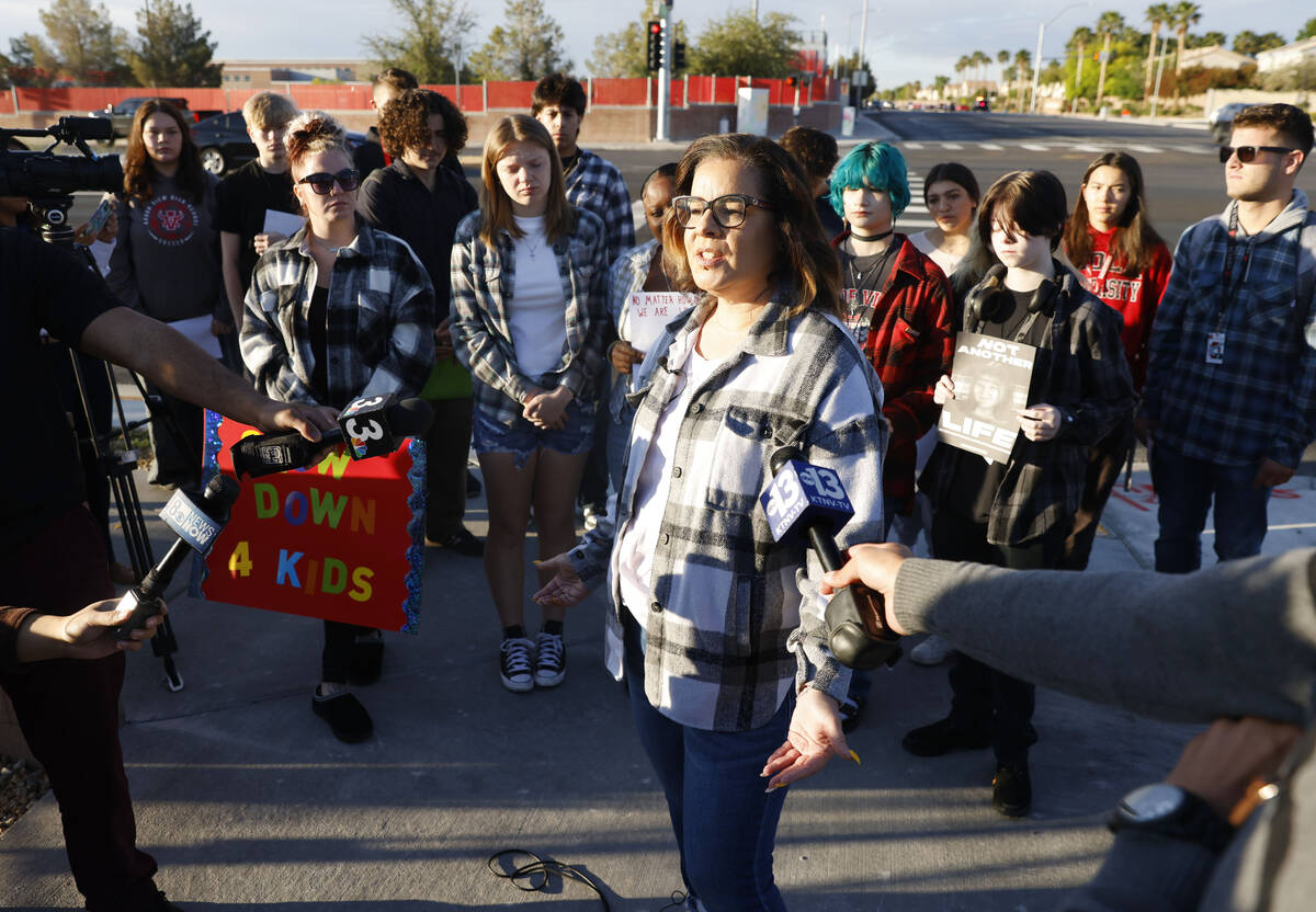 Krista Holloway, founder of "Walk Safely LV," speaks during a protest demanding justi ...