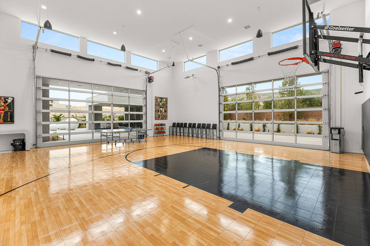 The Ridges home features an indoor basketball court as well as outdoor amenities like a covered ...