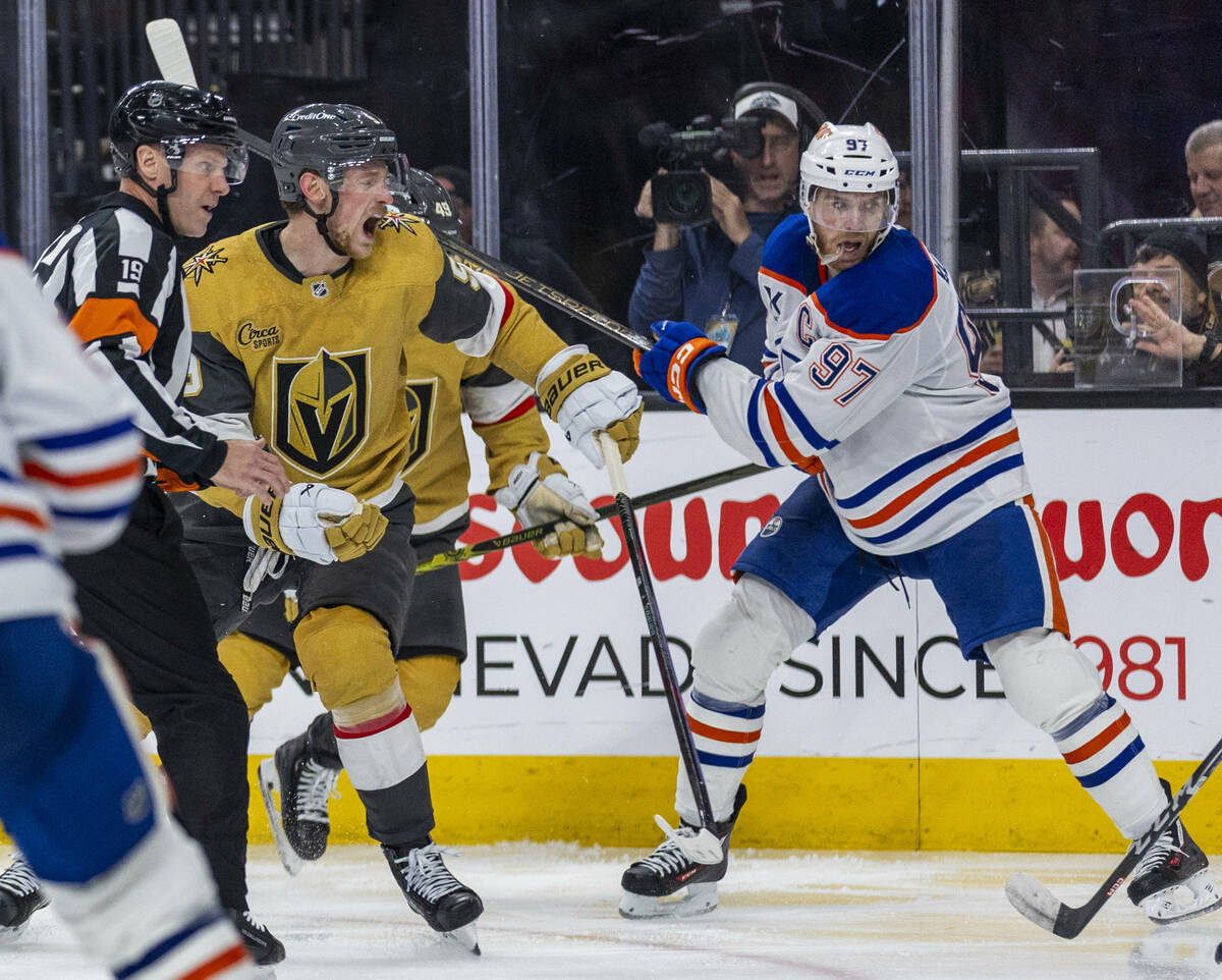 Golden Knights center Jack Eichel (9) races to a stick to the back of the head bye Edmonton Oi ...