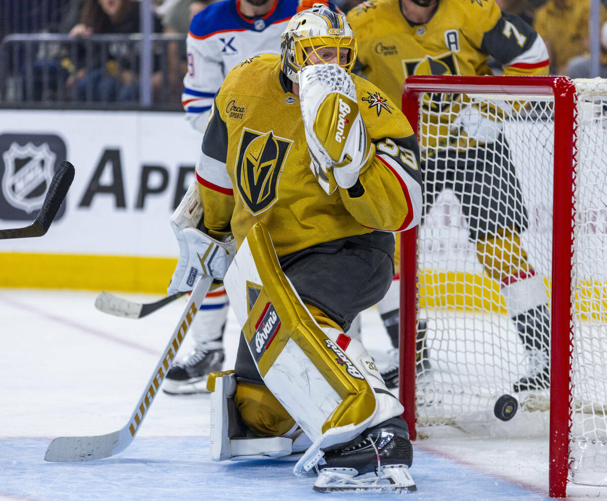 Golden Knights goaltender Adin Hill (33) reacts to a shot by the Edmonton Oilers striking the p ...