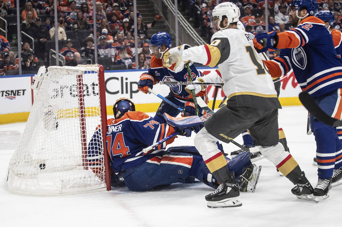 Vegas Golden Knights' Nicolas Roy (10) scores against Edmonton Oilers goalie Stuart Skinner (74 ...