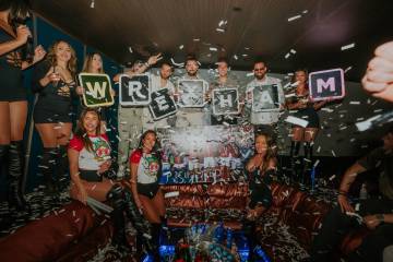 Members of Wrexham A.F.C. celebrate the team's promotion to the English Football League Champio ...