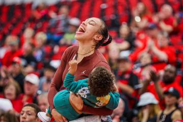 Los Angeles Sparks forward and former Las Vegas Aces player Dearica Hamby cheers for the Lady R ...