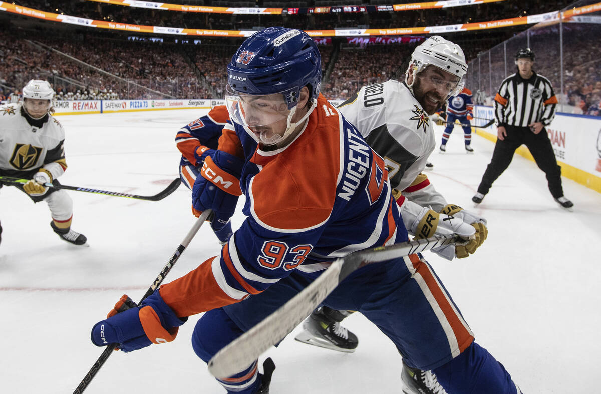 Vegas Golden Knights' Alex Pietrangelo, front right, and Edmonton Oilers' Ryan Nugent-Hopkins ( ...