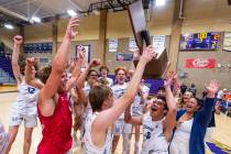 Coronado players celebrate with their trophy defeating Palo Verde to win the 5A boys volleyball ...