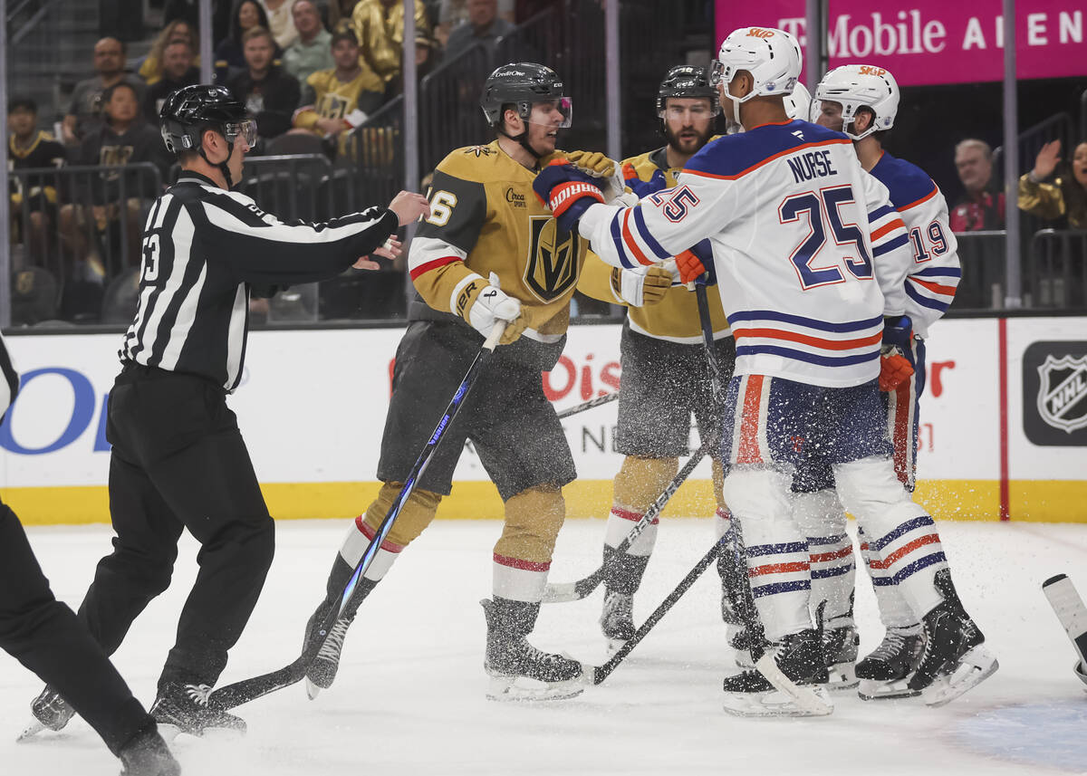 Golden Knights left wing Pavel Dorofeyev (16) fights Edmonton Oilers defenseman Darnell Nurse ( ...