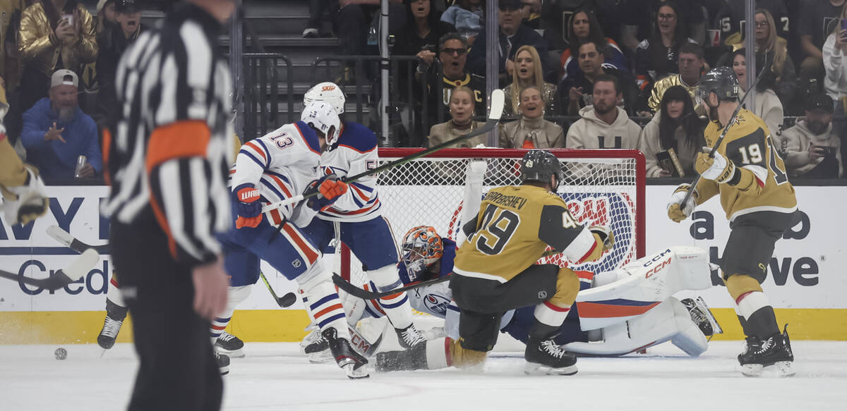 Edmonton Oilers goaltender Stuart Skinner (74) blocks a shot from the Golden Knights during the ...