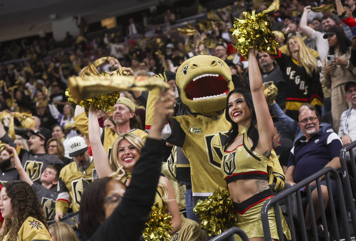 Golden Knights mascot Chance and the Vegas Vivas cheer with fans during the third period of Gam ...