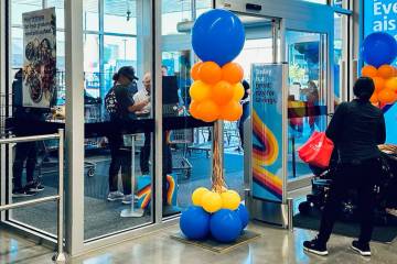 Shoppers enter and exit the Aldi discount grocery store at 7150 S. Rainbow Blvd. during its gra ...