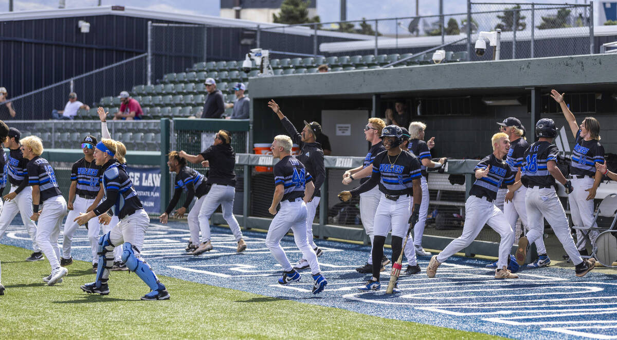 Basic players celebrate late hit against Faith Lutheran during day two of the 5A baseball state ...