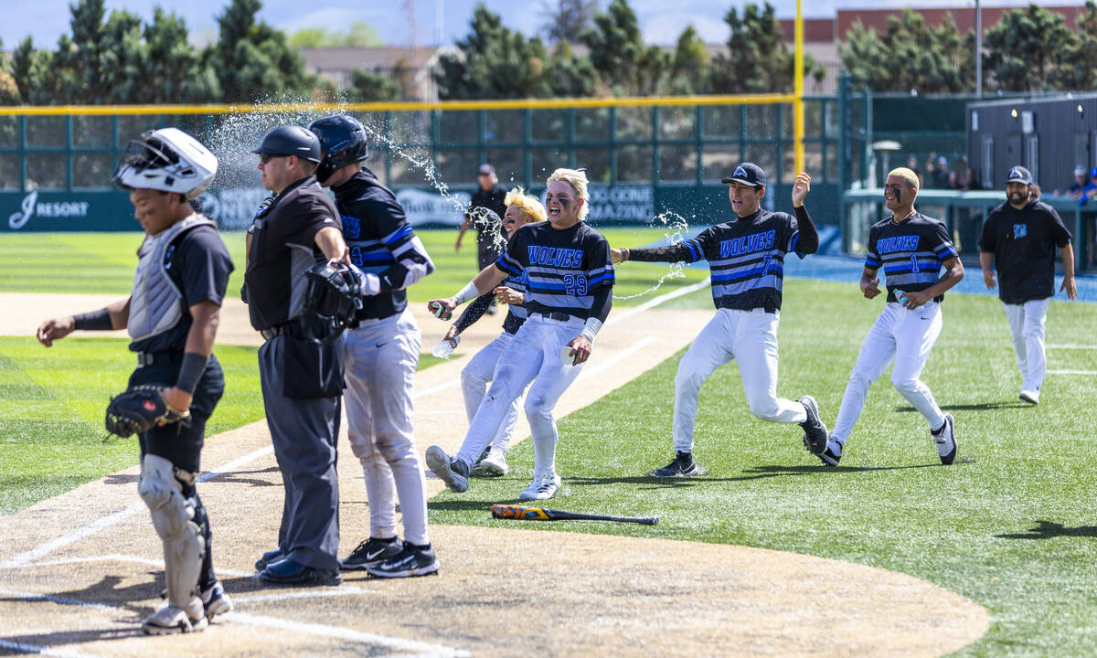 Basic players celebrate a late surge to defeat Faith Lutheran during day two of the 5A baseball ...