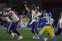 Minnesota Vikings quarterback Sam Darnold (14) looks to pass the ball against the Los Angeles R ...
