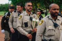 Officers with the Metropolitan Police Department carry flowers in during the annual Southern Ne ...