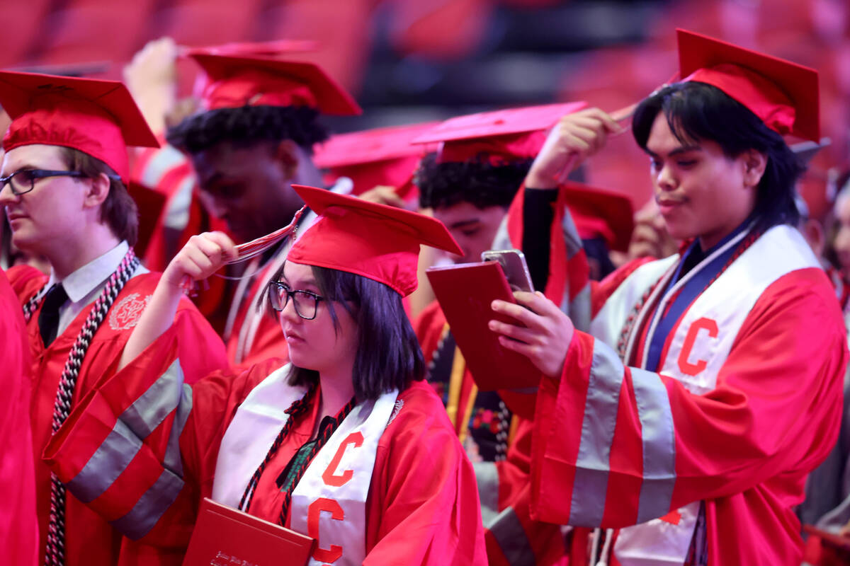 An Arbor View High School student dons a ribbon honoring classmate McKenzie Scott during gradu ...