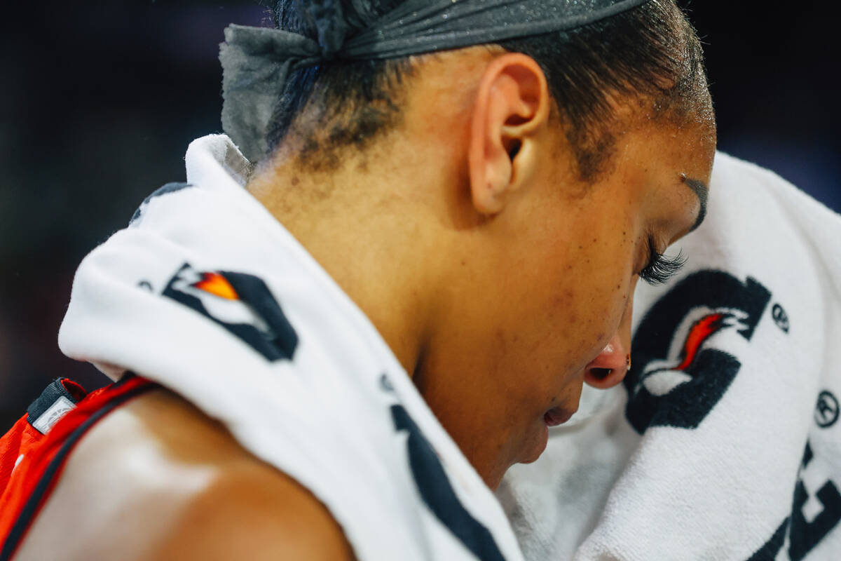 Aces center A'ja Wilson wipes her sweat during a WNBA basketball game between the Aces and Los ...