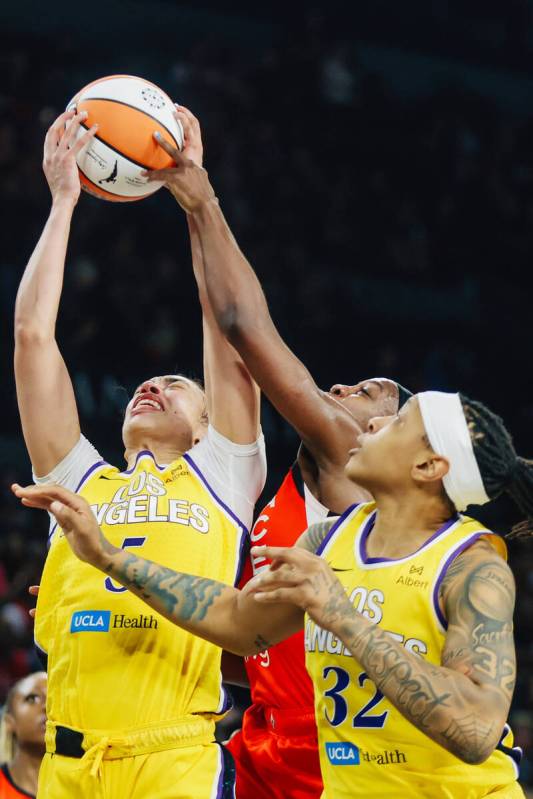 Los Angeles Sparks forward Dearica Hamby (5) struggles to put up a shot during a WNBA basketbal ...