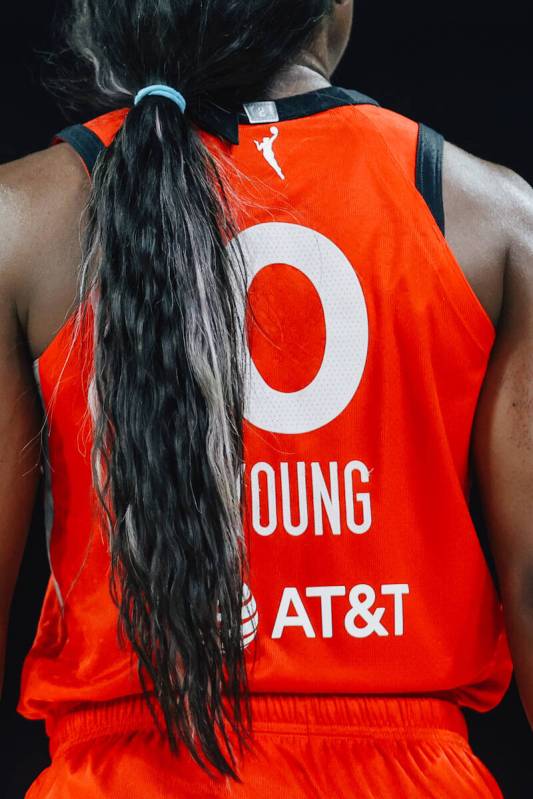 Aces guard Jackie Young walks up the court during a WNBA basketball game between the Aces and L ...