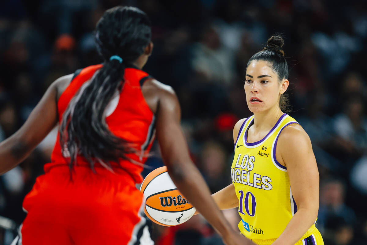 Los Angeles Sparks guard Kelsey Plum dribbles the ball during a WNBA basketball game between th ...