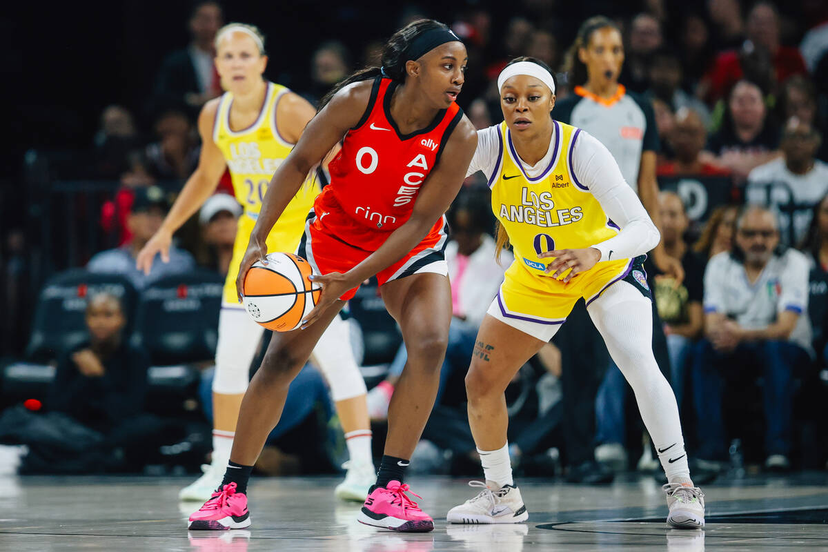 Aces guard Jackie Young (0) looks for an open teammate during a WNBA basketball game between th ...