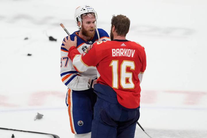 FILE - Florida Panthers center Aleksander Barkov (16) talks to Edmonton Oilers center Connor Mc ...