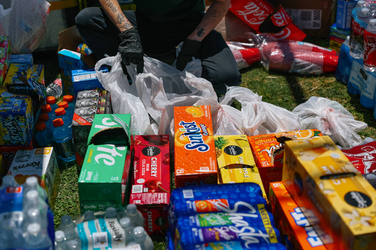 Boxes and boxes of soda, energy drinks and water lay in a stockpile for volunteers with Beauty ...